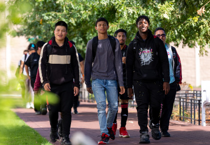 DC United Soccer player kicking ball with eagle mascot