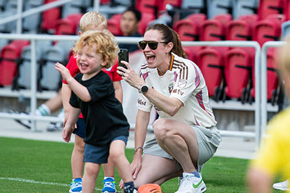kid and mom on soccer field