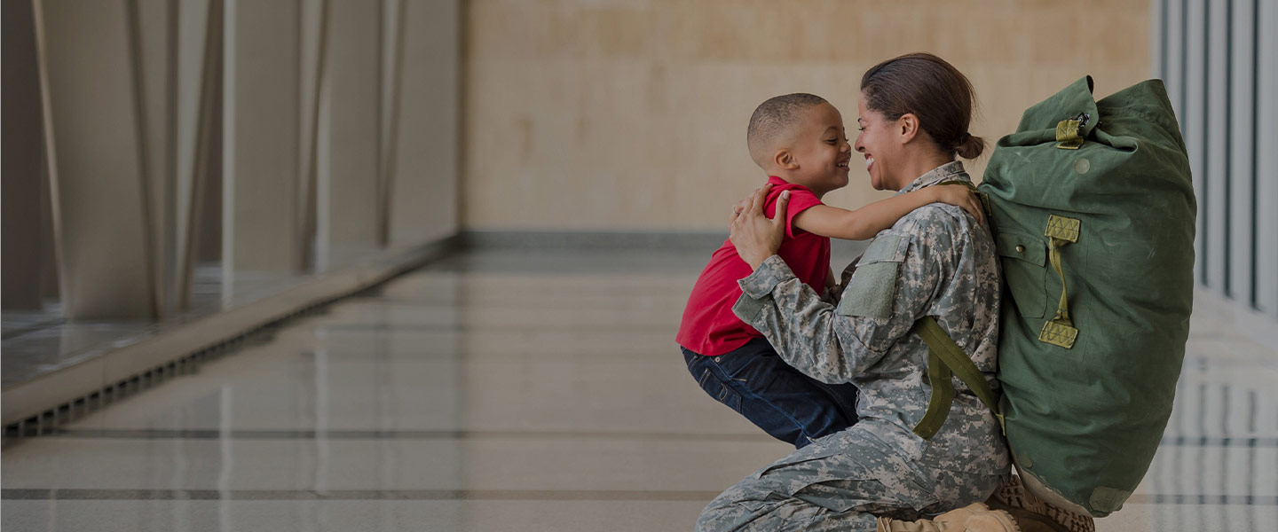 Veteran mom hugging son 440x600