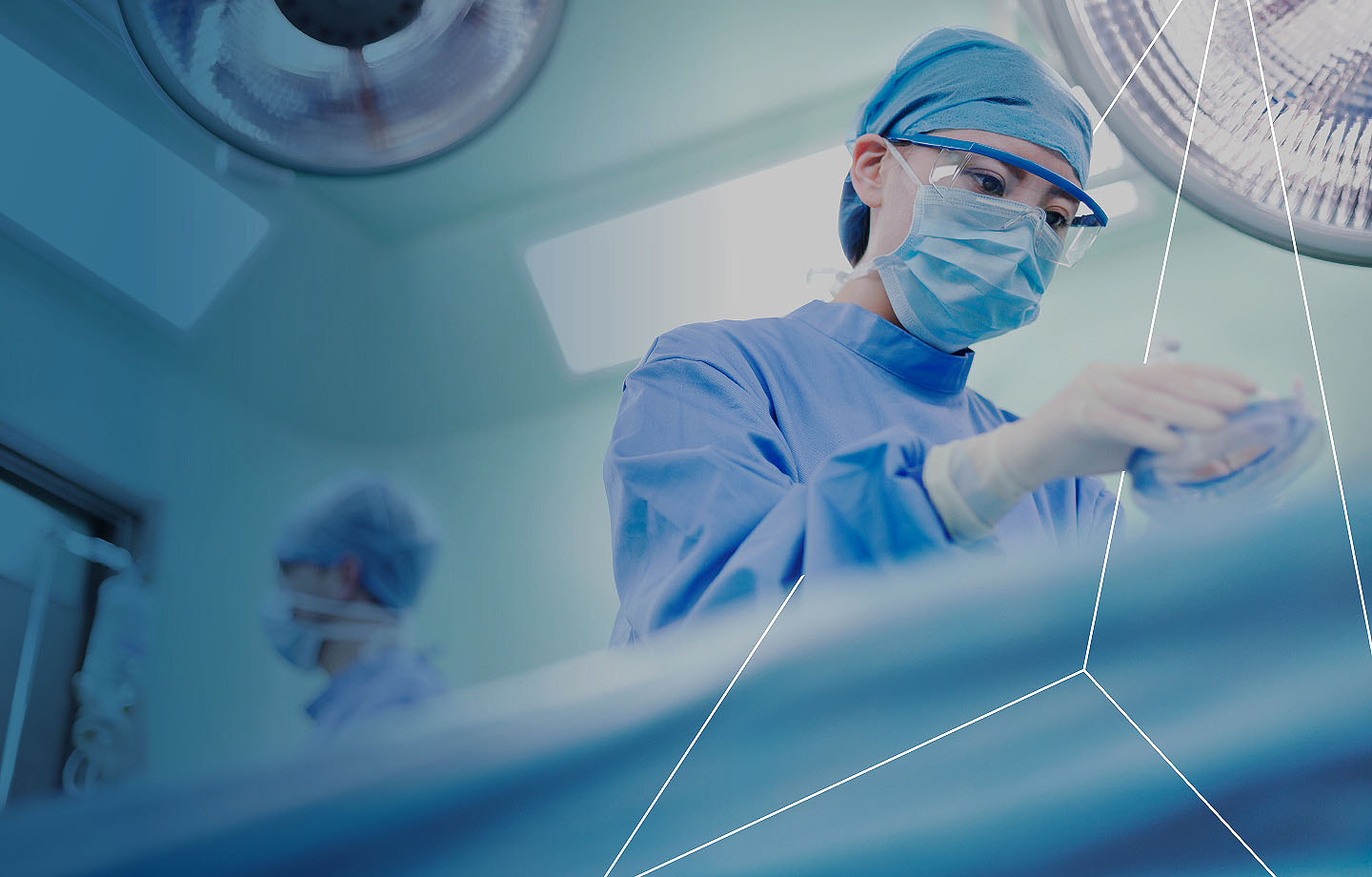 Guidehouse Nurse in scrubs and mask in surgery
