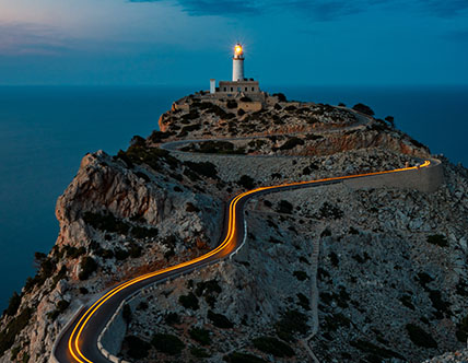 Road leading to a lighthouse with a oceanview