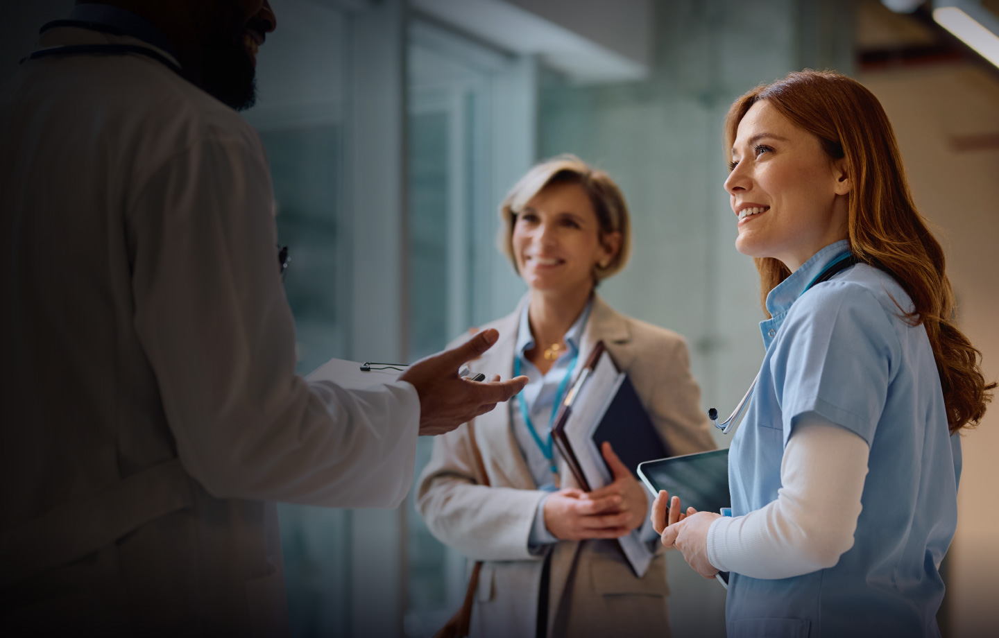 Nurse and health professional discussing with doctor