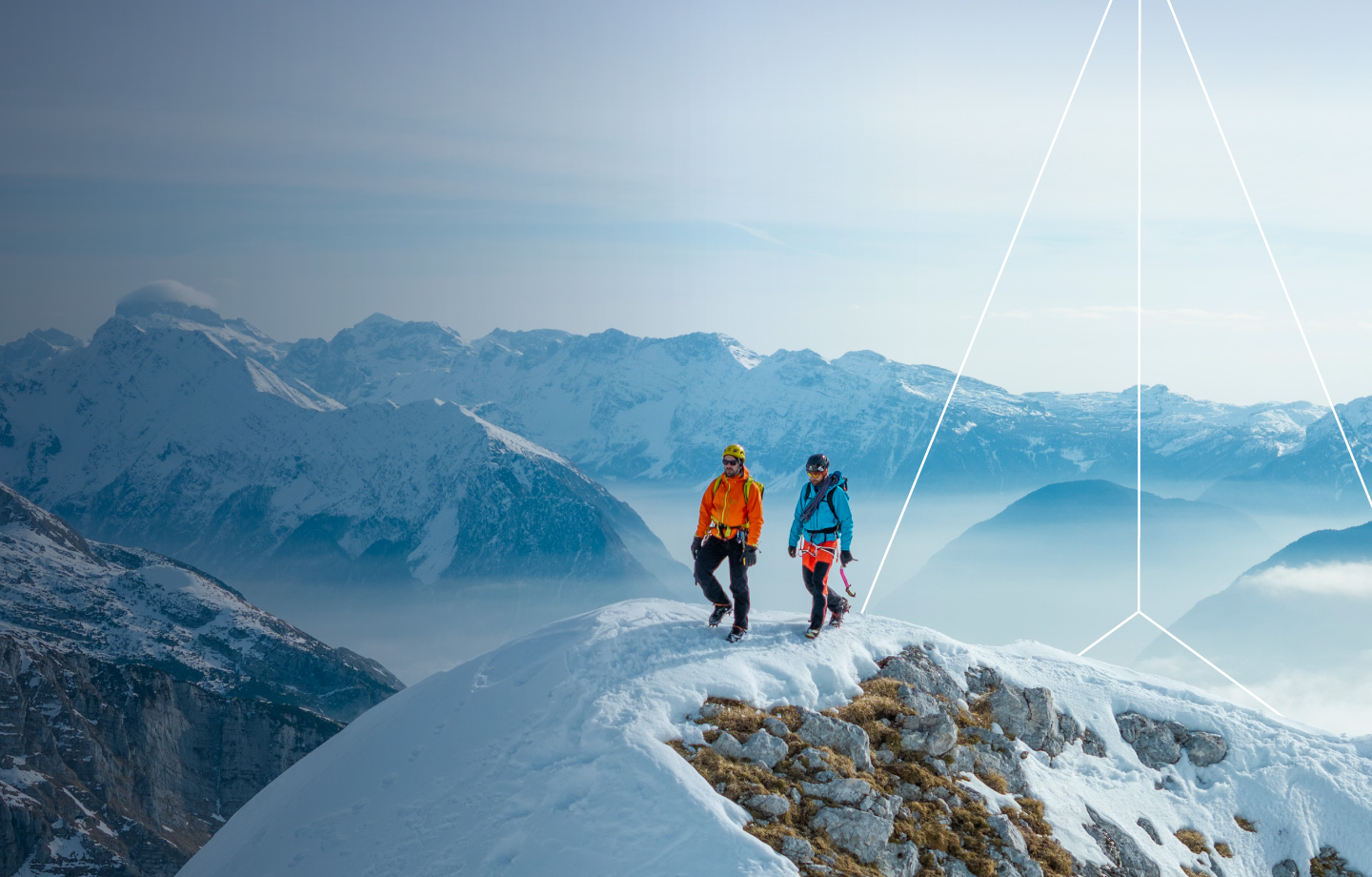 Two hikers on top of snow mountain top