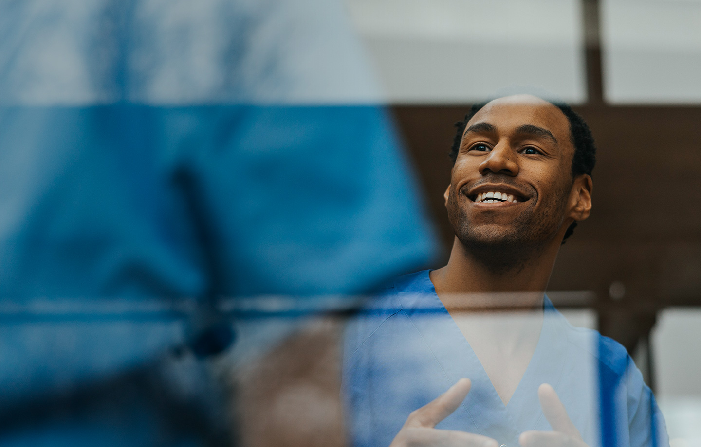 Healthcare professionals talking to one another