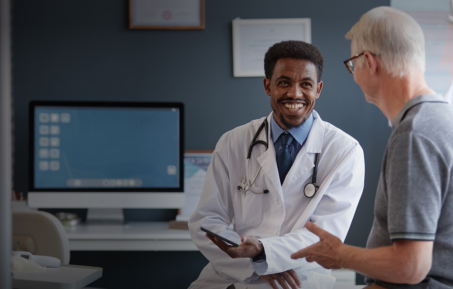 male doctor and male patient having conversation
