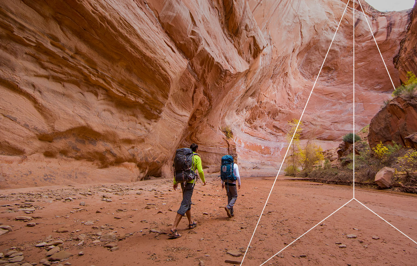 Hikers through a canyon