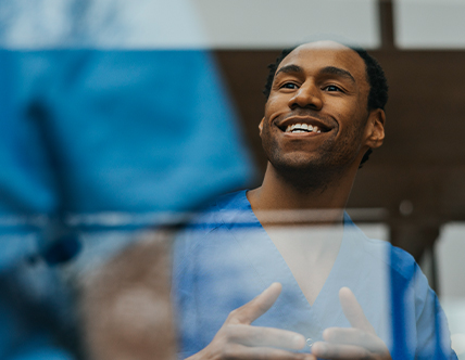 Healthcare professionals talking to one another