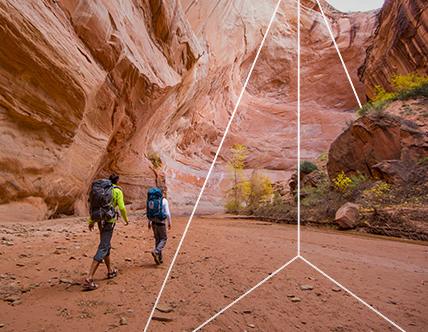 Hikers through a canyon