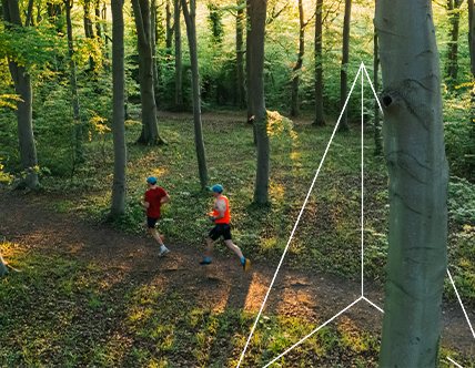Two runners in the woods