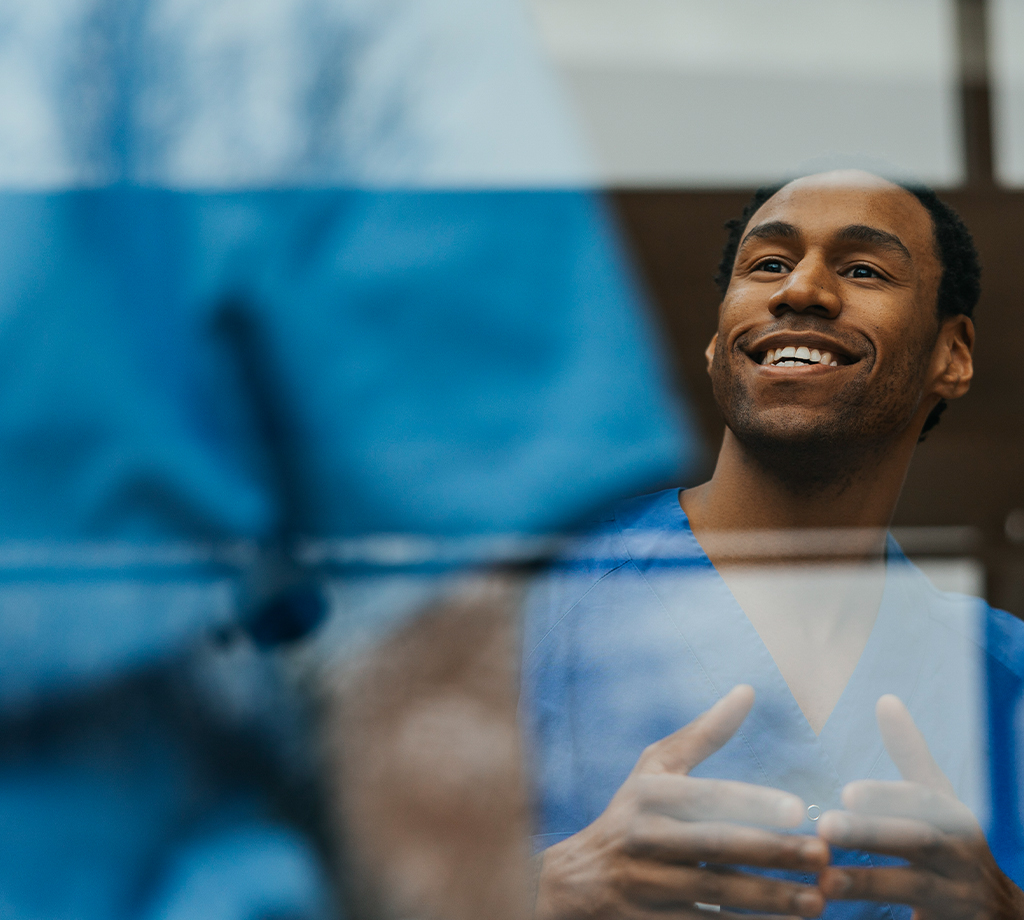 Healthcare professionals talking to one another