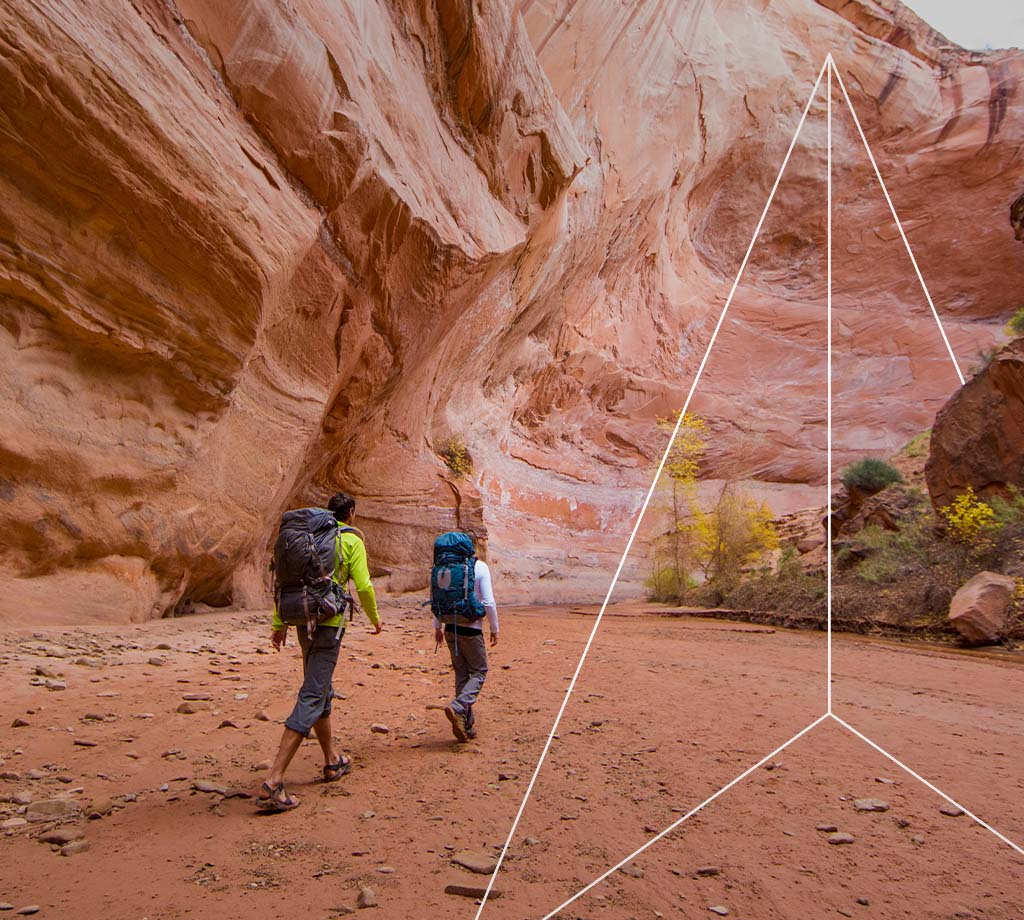 Hikers through a canyon
