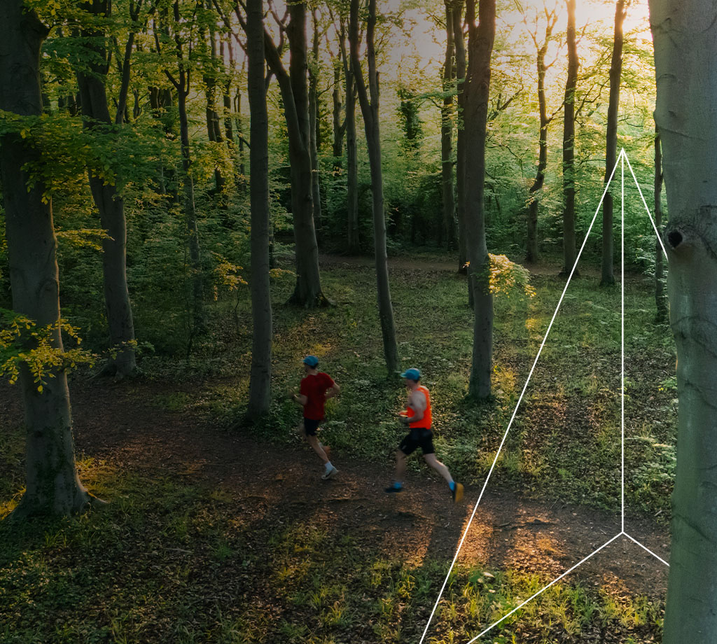 Two runners in the woods