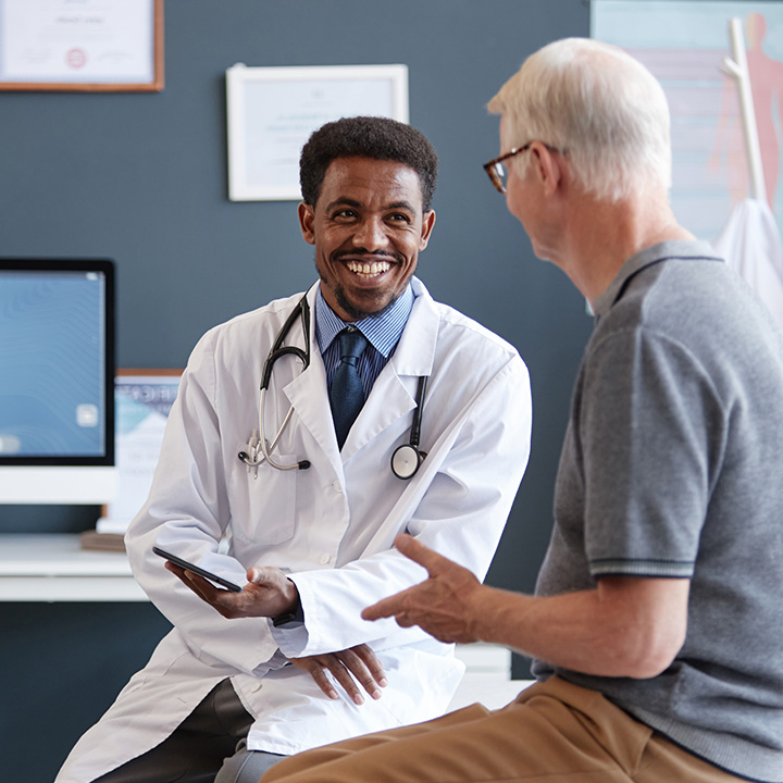 male doctor and male patient having conversation