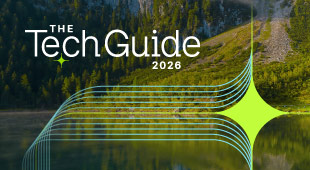 lake side view with green trees with The Tech Guide overlay