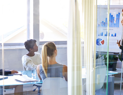 people watching data presentation from table