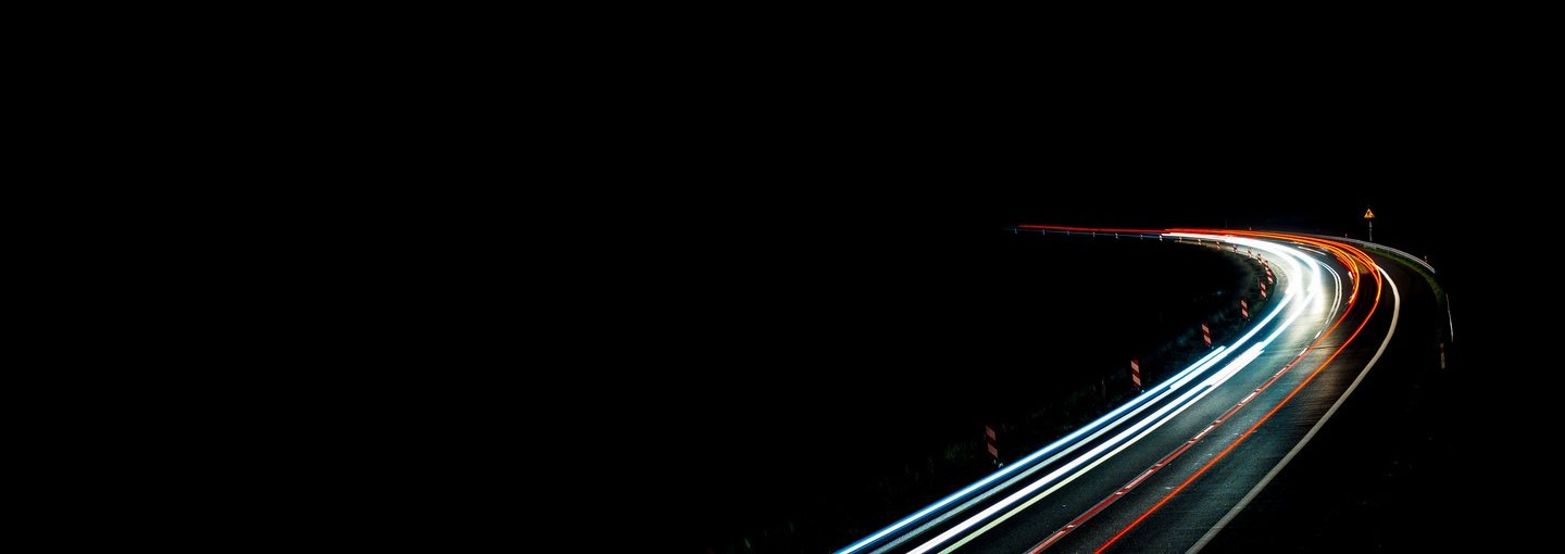 Black sky with lit road