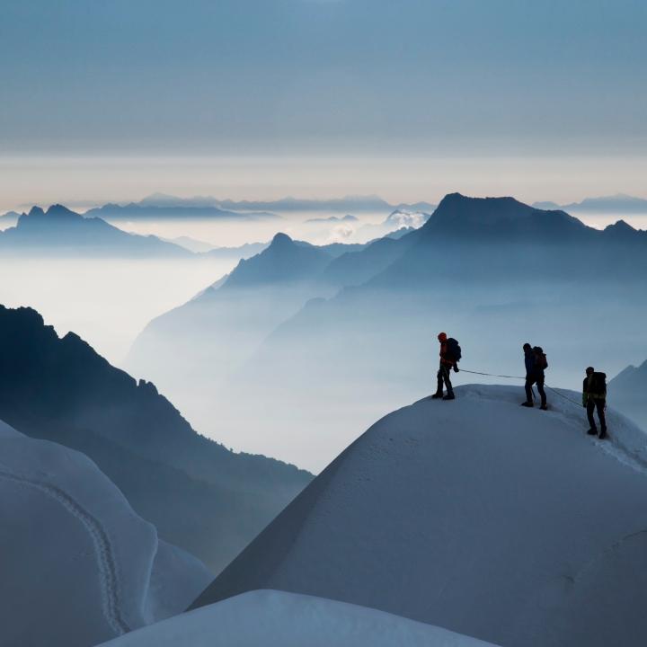  Climbing team on a snowy ridge 
