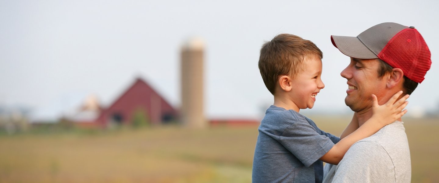 Dad and son on farm