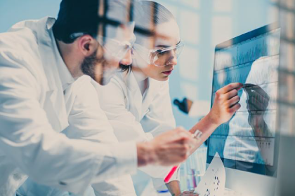two doctors with glass in front of them