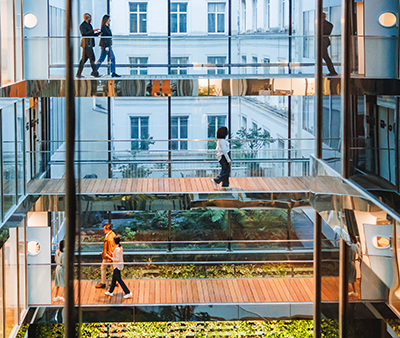 Glass building people walking