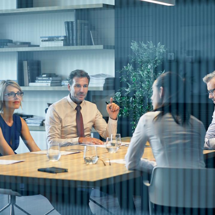 4 employees in a meeting in conference room