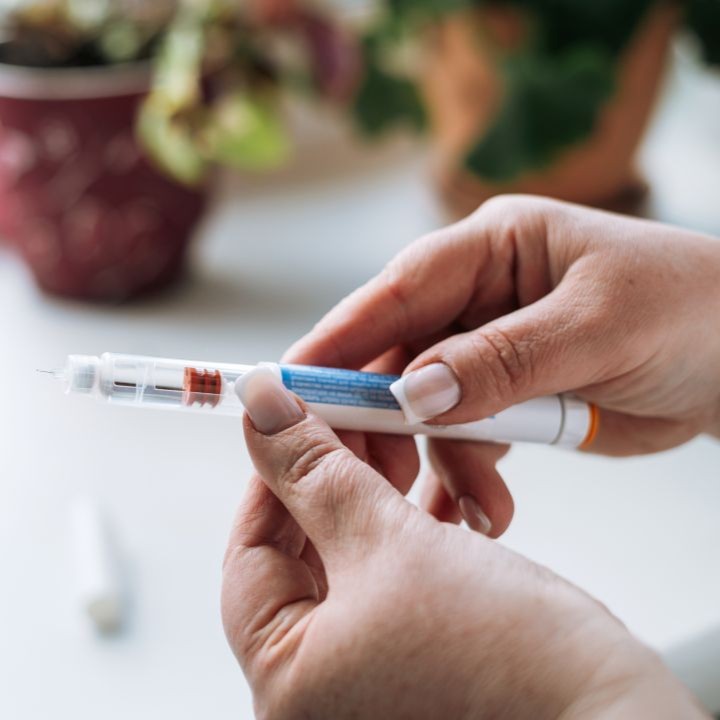 Health professional holding medication