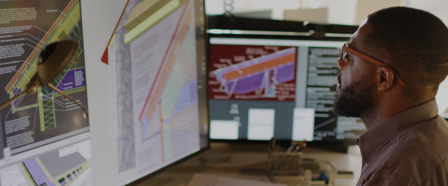 Man looking at architecture on computer