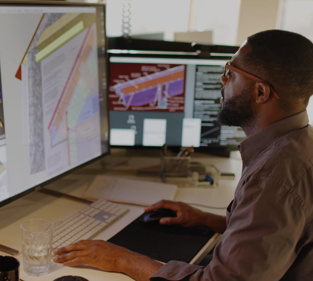 Man looking at architecture on computer